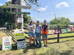 Visitors standing at the Redwood Hill Farm entrance